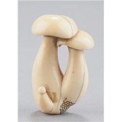 An ivory netsuke of shitake mushrooms.