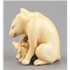 Image 4 : An ivory netsuke of a fox and her cub.
