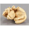 Image 5 : An ivory netsuke of a fox and her cub.