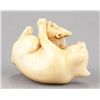 Image 7 : An ivory netsuke of a fox and her cub.