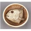Image 1 : An ivory netsuke of a fish head in a bowl.