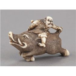 An ivory netsuke of Nitta no Shiro killing the boa