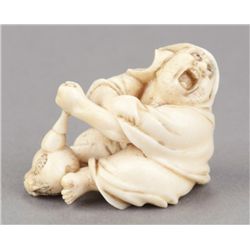 An ivory figure of Daruma.