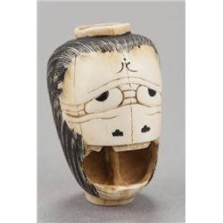 An ivory netsuke of a lantern.