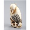 Image 2 : An ivory netsuke of a cockatoo.