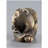 Image 5 : An ivory netsuke of a monkey.