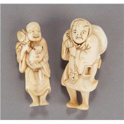 A group of two carved ivory netsuke.