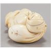 Image 3 : A group of two carved ivory netsuke.