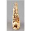 Image 4 : An ivory netsuke of a dragon emerging from an alms