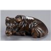Image 1 : A wood netsuke of a recumbent ox.