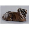 Image 3 : A wood netsuke of a recumbent ox.