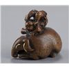 Image 3 : A wood netsuke of an acrobat on a Baku.