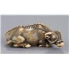 Image 1 : An ivory netsuke of a recumbent bull.
