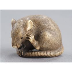 An ivory netsuke of a rat.