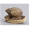 Image 3 : An ivory netsuke of a quail perched on millet seed