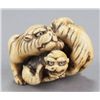 Image 1 : A ivory netsuke of a tigress and two cubs.