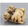 Image 2 : A ivory netsuke of a tigress and two cubs.