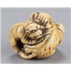 Image 3 : A ivory netsuke of a tigress and two cubs.