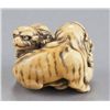 Image 4 : A ivory netsuke of a tigress and two cubs.
