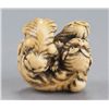 Image 7 : A ivory netsuke of a tigress and two cubs.