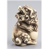 Image 1 : An ivory netsuke of a Shishi.