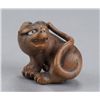 Image 1 : A wood netsuke of a tiger.