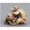 Image 5 : An ivory netsuke of two monkeys.