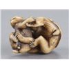 Image 7 : An ivory netsuke of two monkeys.