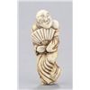Image 1 : An ivory netsuke of a dancer.