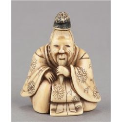 An ivory netsuke of a seated Court figure.