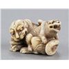 Image 1 : An ivory netsuke of two tigers.