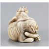 Image 3 : An ivory netsuke of two tigers.
