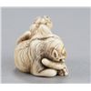 Image 4 : An ivory netsuke of two tigers.