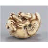 Image 7 : An ivory netsuke of two tigers.
