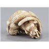 Image 9 : An ivory netsuke of two tigers.