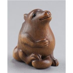 A wood netsuke of Tanuki.