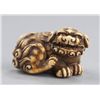 Image 1 : An ivory netsuke of a Shishi.