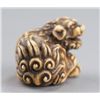 Image 5 : An ivory netsuke of a Shishi.