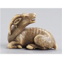 An ivory netsuke of a stag.