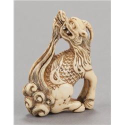 An ivory netsuke of a single-horned Kirin.