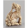 Image 1 : An ivory netsuke of a single-horned Kirin.