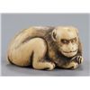 Image 1 : An ivory netsuke of a monkey.