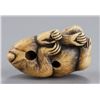 Image 6 : An ivory netsuke of a monkey.