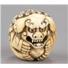 Image 2 : An ivory netsuke of a Shishi.