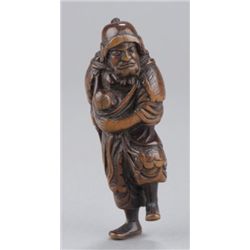 A wood netsuke of Ishikawa Goemon with Ichiro.
