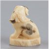 Image 3 : A narwhal ivory netsuke of a Piebald pup.