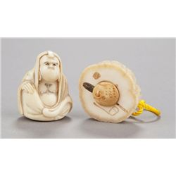 A group of two narwhal ivory netsuke.