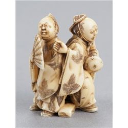 An ivory netsuke of two dancers.