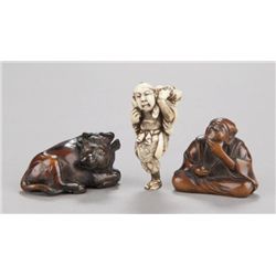 A group of three netsuke of various materials.