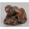 Image 9 : A group of three netsuke of various materials.